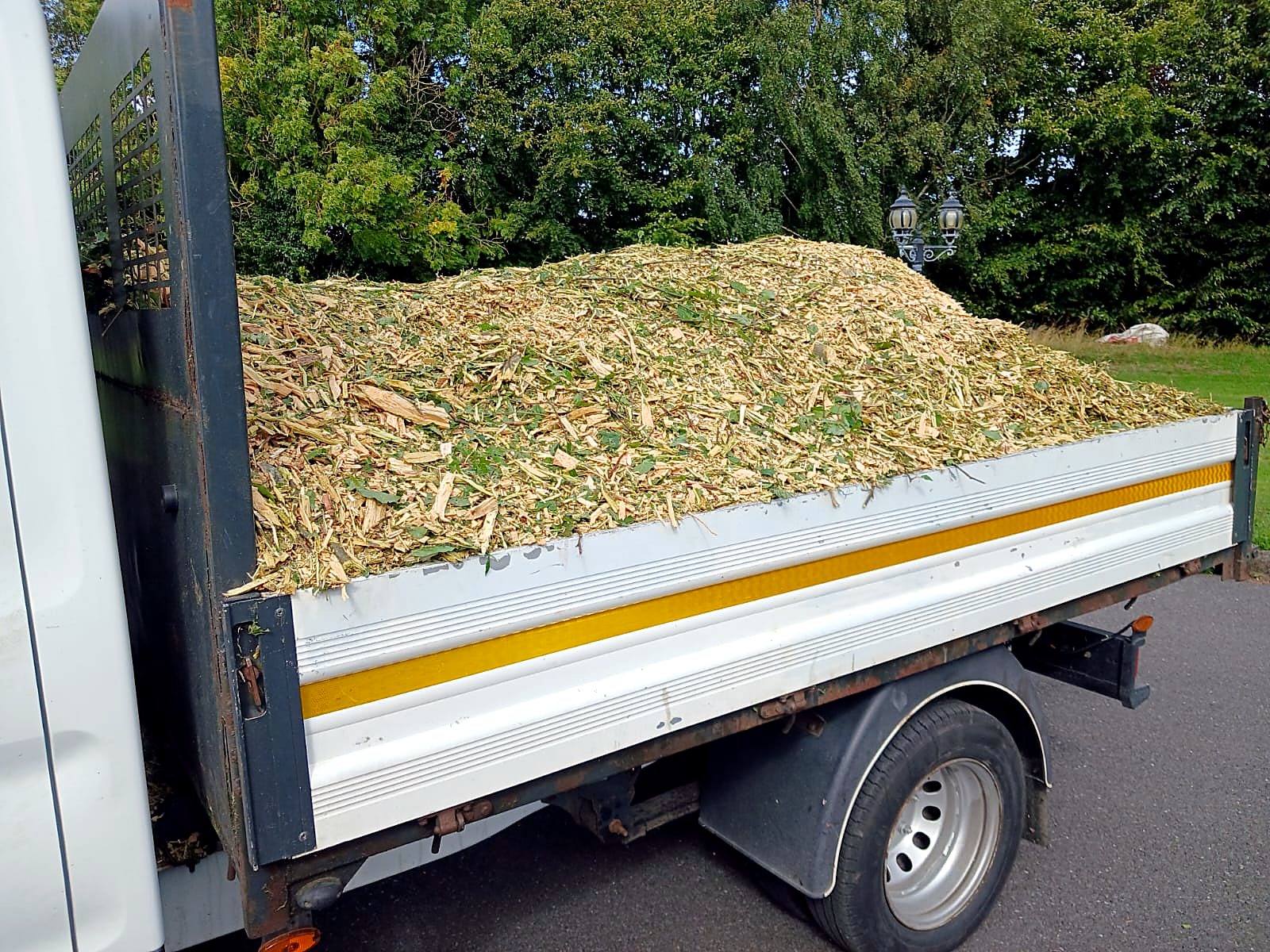Truck full of wood chippings after a tree job